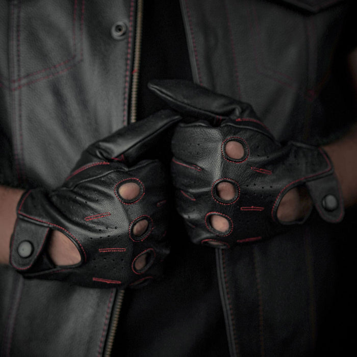 Leatherick men's black genuine leather driving gloves with red stitching and knuckle holes worn with a matching leather waistcoat.