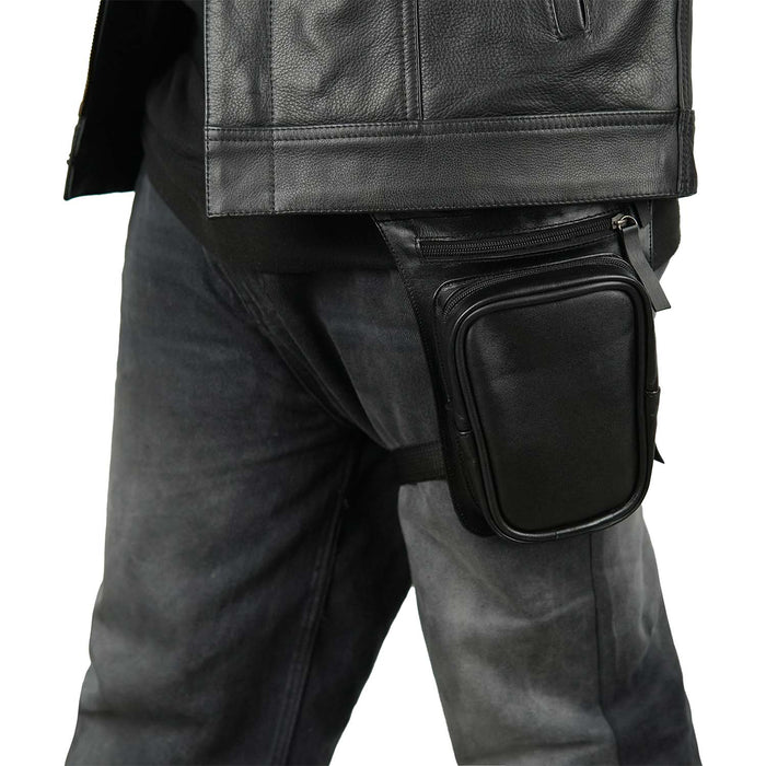 Side view of a biker wearing a black real leather drop leg bag with a secure thigh strap and zip pocket for easy storage.