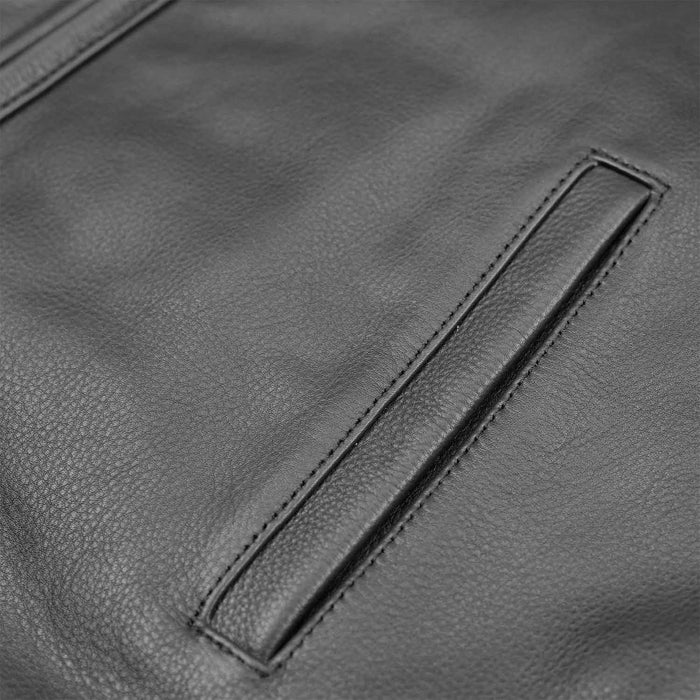 A close-up of a side welt pocket on a men's black genuine leather biker waistcoat showing the fine stitching and grain texture.